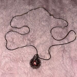 Intricate Silver Necklace with Red Accent